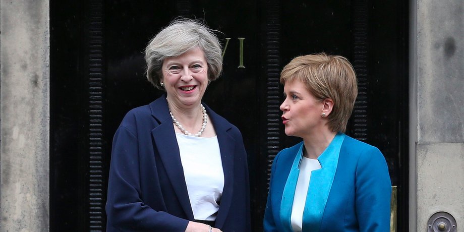 Scotland's First Minister, Nicola Sturgeon (R), greets Britain's new Prime Minister, Theresa May, as she arrives at Bute House in Edinburgh, Scotland, Britain July 15, 2016.