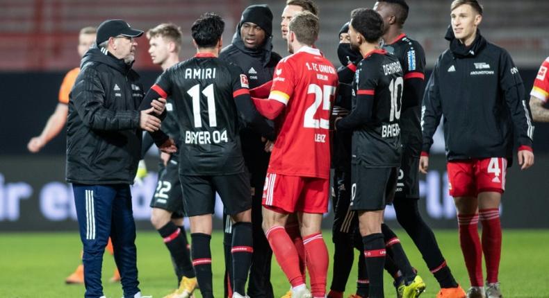 Leverkusen midfielder Nadiem Amiri (2nd from left) argues with Union Berlin players after the final whistle on Friday