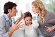 Couple fighting in front of child