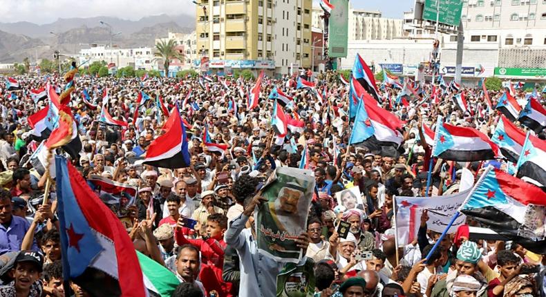 Supporters of separatists wave flags of the former South Yemen in the southern port city of Aden