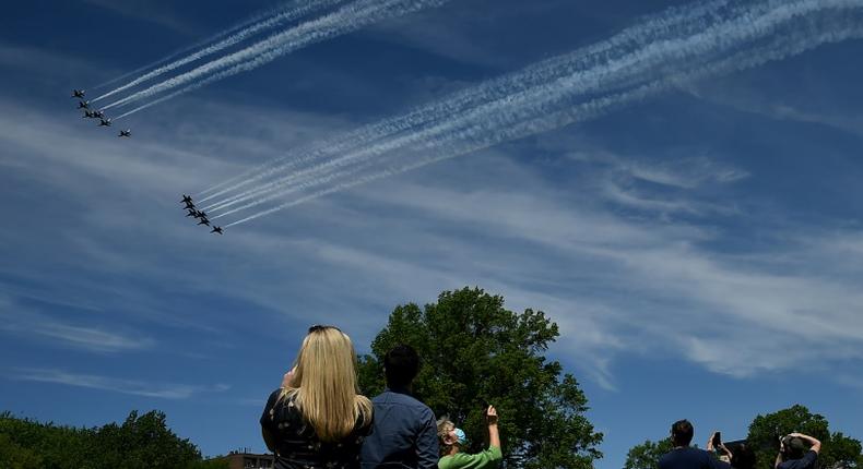 The US Navy Blue Angels and US Air Force Thunderbirds fly over Washington, DC