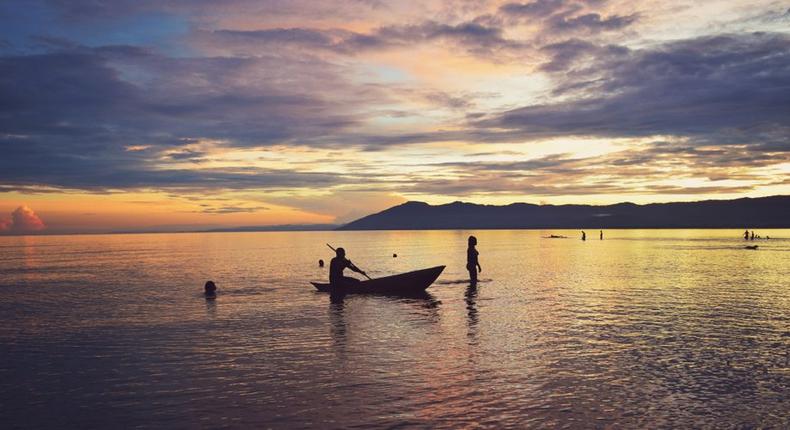 Sunset silhouette at Kande Beach, Nkhata Bay, Lake Malawi, Malawi