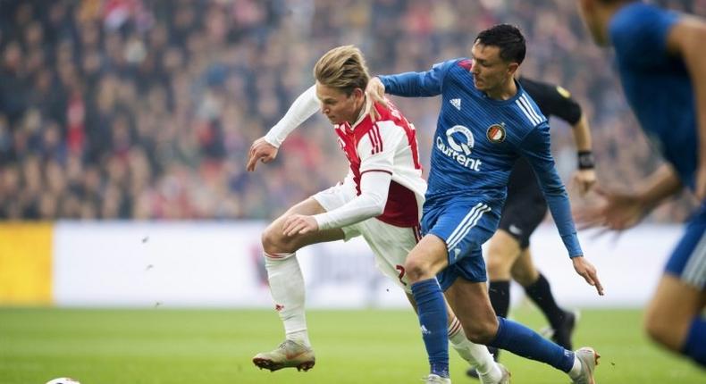 Ajax and Netherlands star Frenkie de Jong (L) in action against Feyenoord's Steven Berghuis (R).