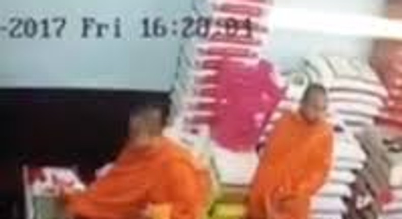 Monks stealing iphone in a rice shop