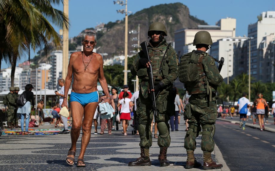 Brazilian navy soldiers patrol the Copacabana beach as part of a plan to combat organized crime in Rio de Janeiro, Brazil, July 30, 2017.