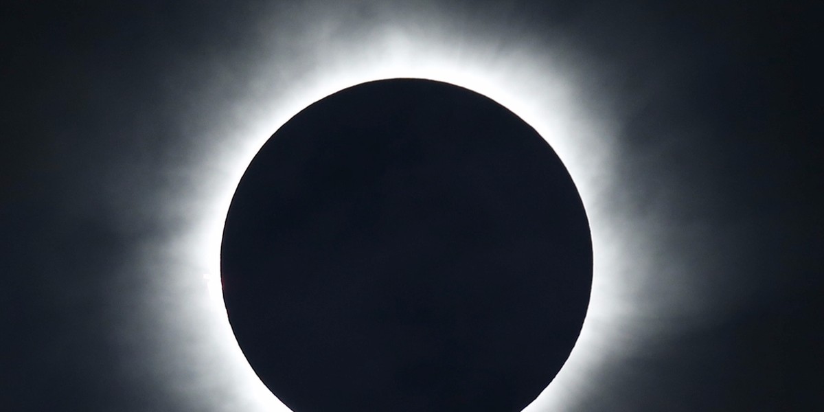 A total solar eclipse is seen from the beach of Ternate island, Indonesia.