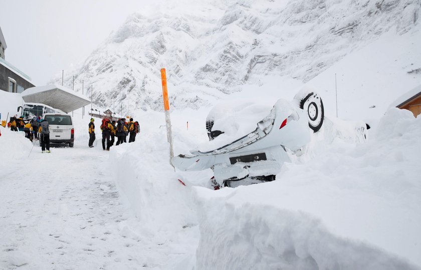 Workers shovel snow out of a restaurant after an avalanche at Santis-Schwaegalp mountain resort