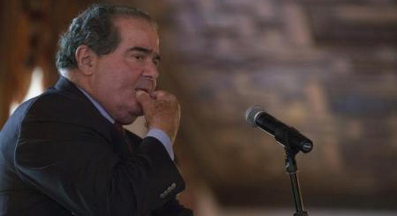 U.S. Supreme Court Justice Antonin Scalia listens to a question after speaking at an event sponsored by the Federalist Society at the New York Athletic Club in New York October 13, 2014.