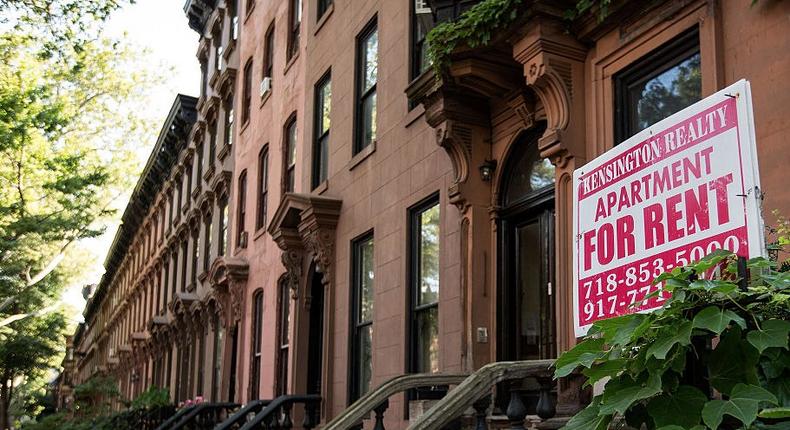 A sign advertising an apartment for rent along a row of brownstone townhouses in the Fort Greene neighborhood on June 24 in Brooklyn, New York.