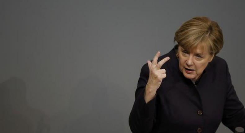 Defiant Merkel vows to stand by refugee policy despite security fears