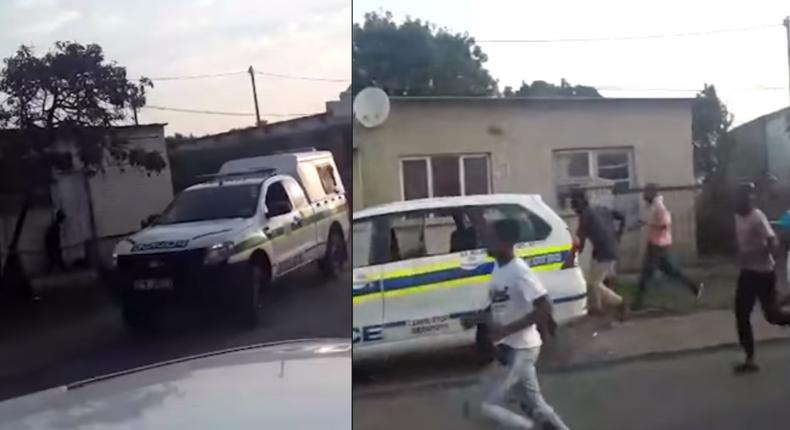 Terrified police officers abandon vehicle, run helter-skelter to avoid lynching by stone throwing mob (video)