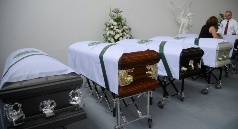 Coffins of members of the Brazilian football team Chapecoense Real the were killed in a plane crash in the Colombian mountains, are seen at the San Vicente mortuary in Medellin on December 1, 2016