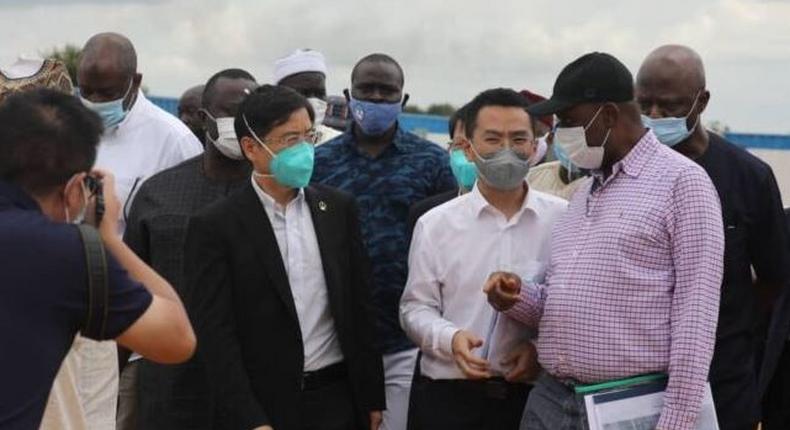 The Minister of Transportation, Rotimi Ameachi at the site of the Transportation University in Daura with the Chinese Contractors. (TheCable)