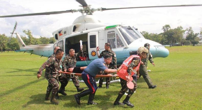 The injured security personnel arrive at a medical facility via a presidential airlift.