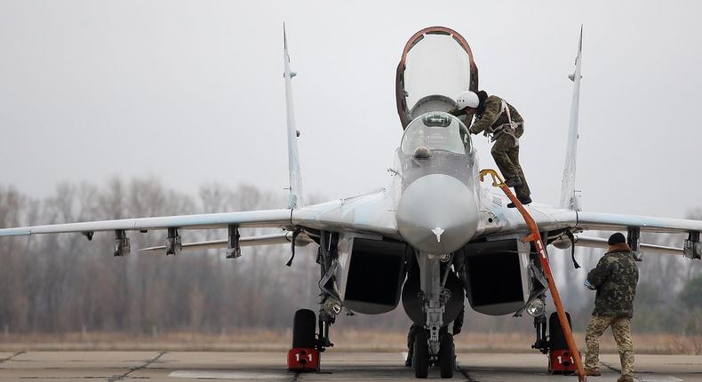 A Ukrainian pilot exits a MiG-29 fighter jet at an airbase outside of Kyiv, November 23, 2016.