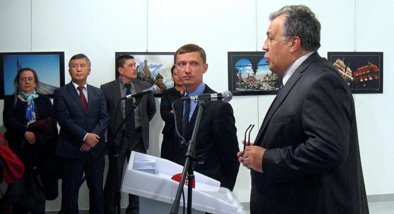 Andrei Karlov, the Russian ambassador to Ankara, gives a speech before being shot dead by a gunman at an art exhibition in Ankara on December 19, 2016