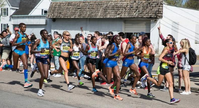 Spectators cheer the elite women as they make their way past the 6 mile mark of the Boston Marathon on April 17, 2017 in Framingham, Massachusetts