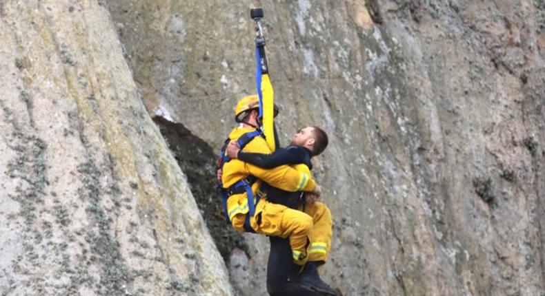 Man gets stuck on 600ft cliff edge after climbing rock to propose