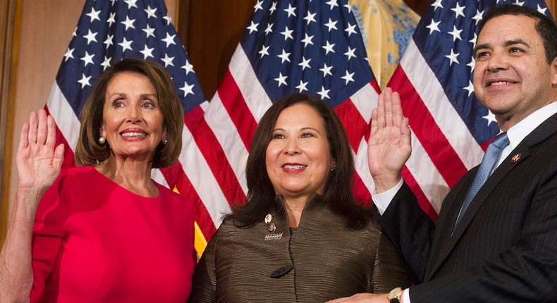 House Speaker Nancy Pelosi poses during a ceremonial swearing-in with Rep. Henry Cuellar on January 3.