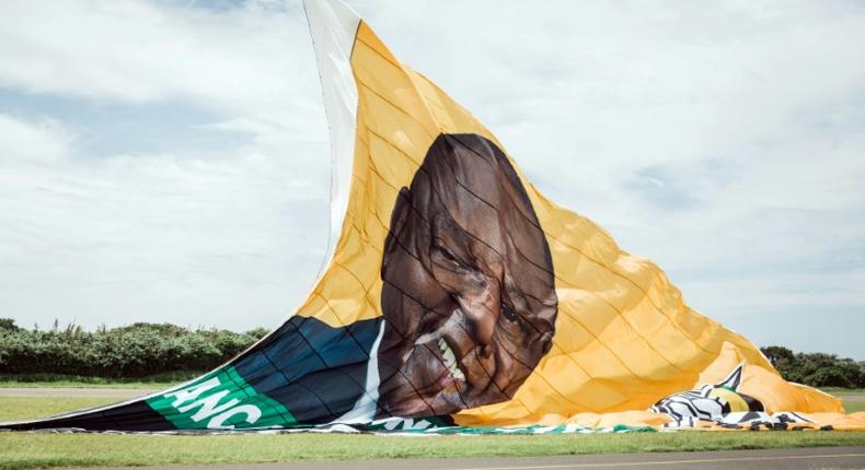 On the up: The ANC hoisted a giant New Year's banner bearing the face of Cyril Ramaphosa, credited with reviving party fortunes after the scandal-hit era of Jacob Zuma