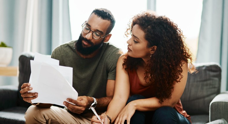 couple doing paperwork at home