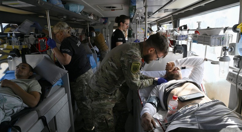 Paramedics checking on servicemen wounded in the Donetsk region of Ukraine.GENYA SAVILOV/ Getty Images