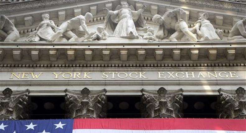 The American flag hangs outside the New York Stock Exchange, July 6, 2015