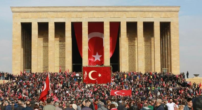 People wave Turkish flags at the Anitkabir, the mausoleum of the founder of Turkish Republic Mustafa Kemal Ataturk, during celebrations marking the 93rd Anniversary of Republic Day in Ankara on October 29, 2016