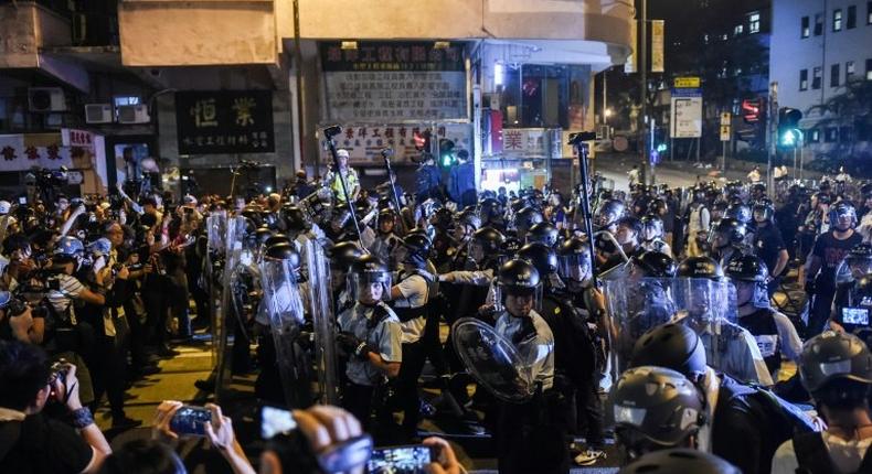 The November protest outside China's liaison office in Hong Kong saw scuffles as demonstrators charged barriers and police used pepper spray to drive them back