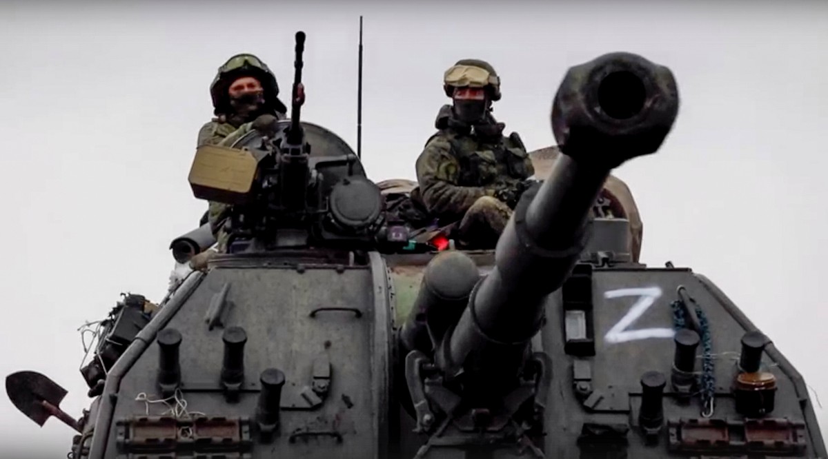 Russian servicemen drive on a 152mm self-propelled artillery system MSTA-S on the march near Kyiv (Kiev), Ukraine