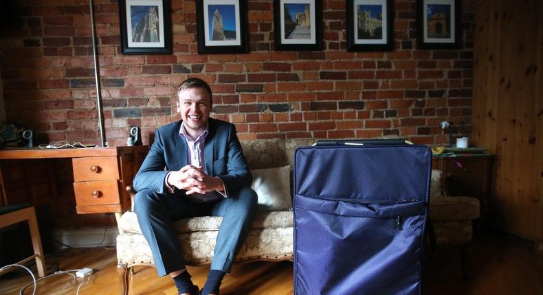 Toronto Star reporter David Bateman poses with his suitcase after his year staying with Airbnb in Toronto.Vince Talotta/Toronto Star via Getty Images
