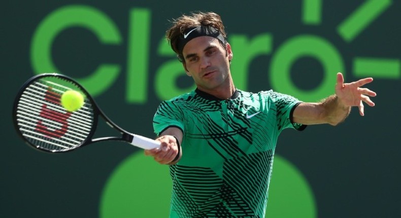 Roger Federer of Switzerland returns a shot against Juan Martin Del Potro of Argentina during Day 8 of the Miami Open at Crandon Park Tennis Center on March 27, 2017 in Key Biscayne, Florida