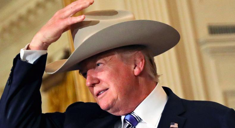 U.S. President Donald Trump wears a cowboy hat as attends a Made in America products showcase event at the White House in Washington, U.S., July 17, 2017.