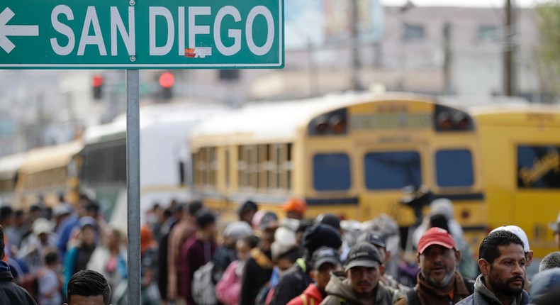 Central American migrants line up for a meal at a shelter in Tijuana, Mexico, Wednesday, Nov. 14, 2018.