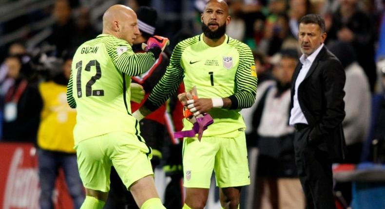 The US national football team goalkeeper Tim Howard (R) leaves the field as Brad Guzan takes his place during their 2018 FIFA World Cup qualifying match against Mexico, in Columbus, Ohio, on November 11, 2016