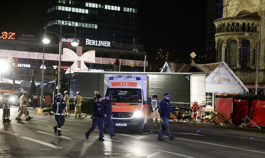 Police stand guard near a Christmas market in Berlin, Germany, December 19, 2016 after a truck ploughed into the crowded Christmas market in the German capital.