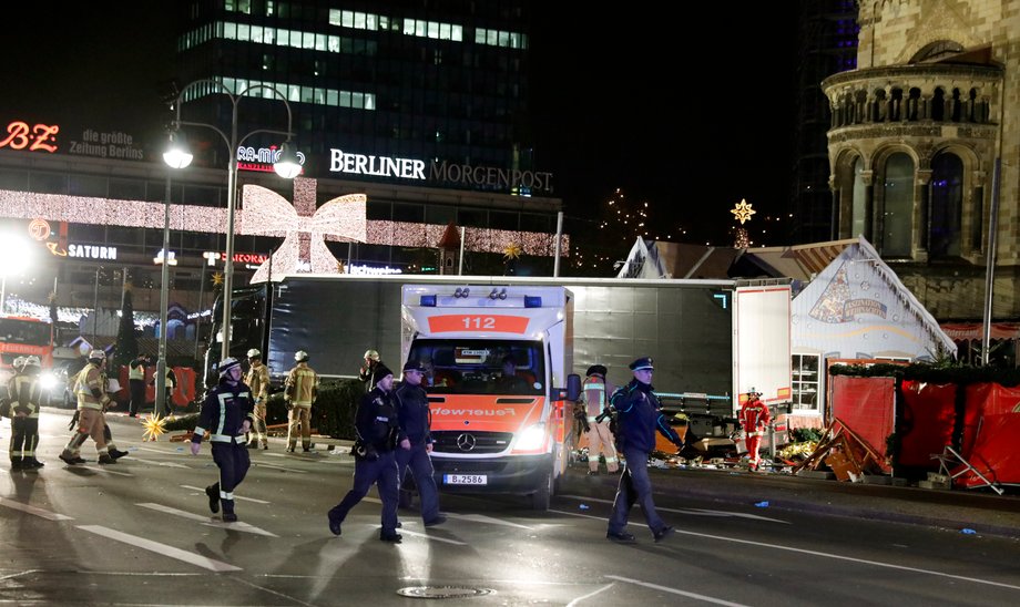 Police stand guard near a Christmas market in Berlin, Germany, December 19, 2016 after a truck ploughed into the crowded Christmas market in the German capital.