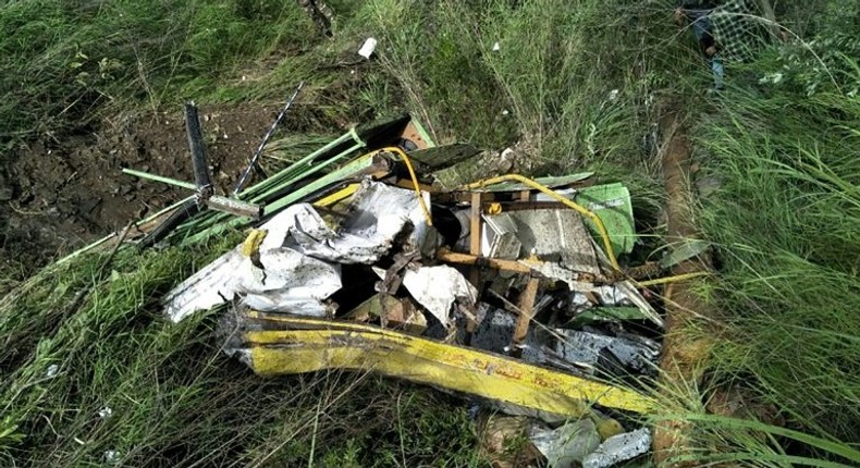 The wreckage of a bus lies in a gorge following an accident near the Indian town of Rampur on July 20, 2017