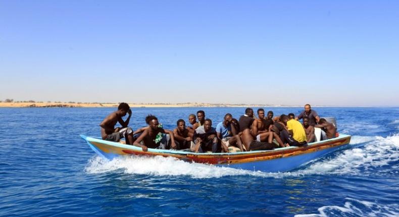 Libyan coastguards help rescue illegal immigrants attempting to reach Europe off the coastal town of Guarabouli, 60 kilometres east of the capital, on July 8, 2017