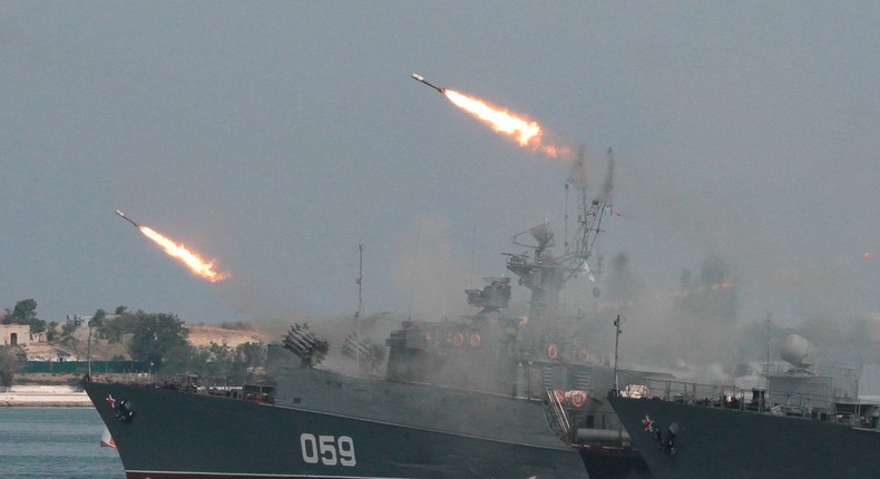 Russia's navy fires cruise missiles.