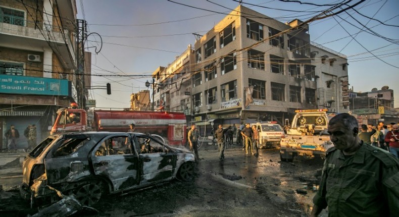 Simultanaous blasts near a busy market and a school in Syria's Kurdish-majority city of Qamishli killed six people and wounded 22