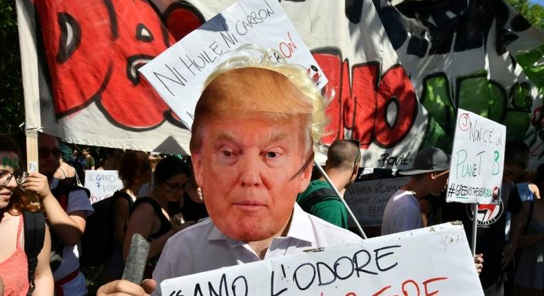 A demonstration against US President Donald Trump's decision to quit the Paris climate accord, at the meeting of G7 environment ministers in Bologna, Italy