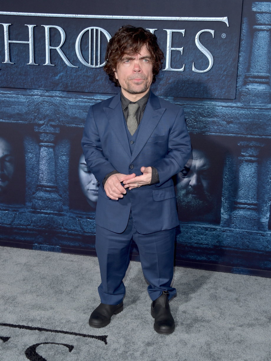 Here he is sporting a blue suit at the premiere event.