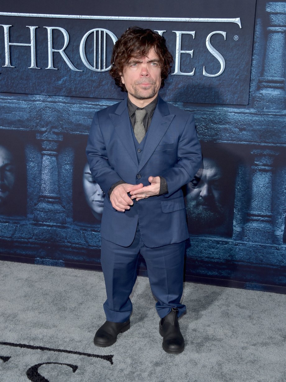 Here he is sporting a blue suit at the premiere event.