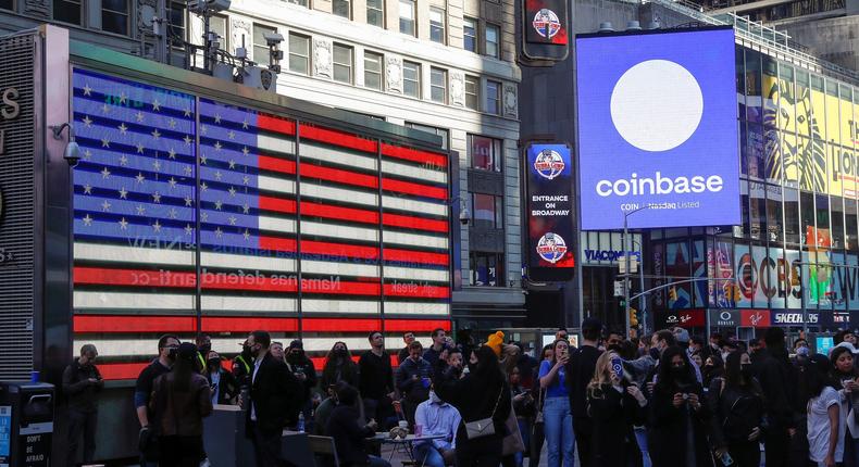 Coinbase Global watch as their listing is displayed on the Nasdaq MarketSite at Times Square in New York on April 14, 2021.
