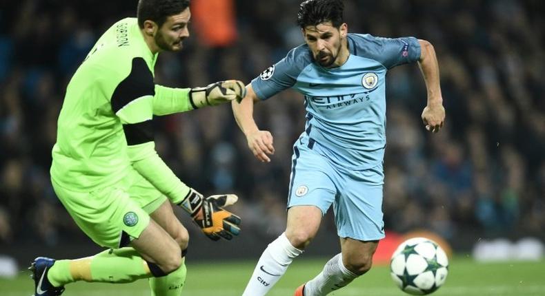 Manchester City's Spanish midfielder Nolito (R) vies with Celtic's Scottish goalkeeper Craig Gordon during the UEFA Champions League group C football match between Manchester City and Celtic on December 6, 2016