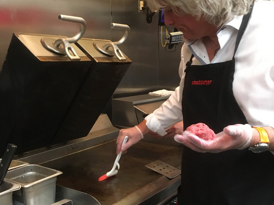 The hot — 385-degree — grill top is coated with unsalted butter, so the burger won't stick to the grill.