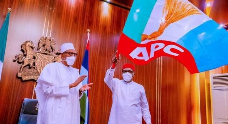 President Muhammadu Buhari after handing the APC flag to Senator Andy Uba. [Presidency]