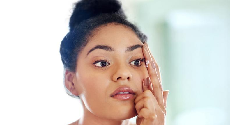 Lady fixing contact lens