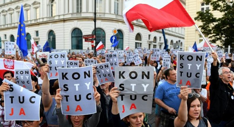 Protesters held posters reading constitution during a protest in Warsaw last month to urge the president veto reforms that would give the government more control over courts.